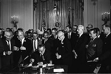220px-Lyndon_Johnson_signing_Civil_Rights_Act,_July_2,_1964